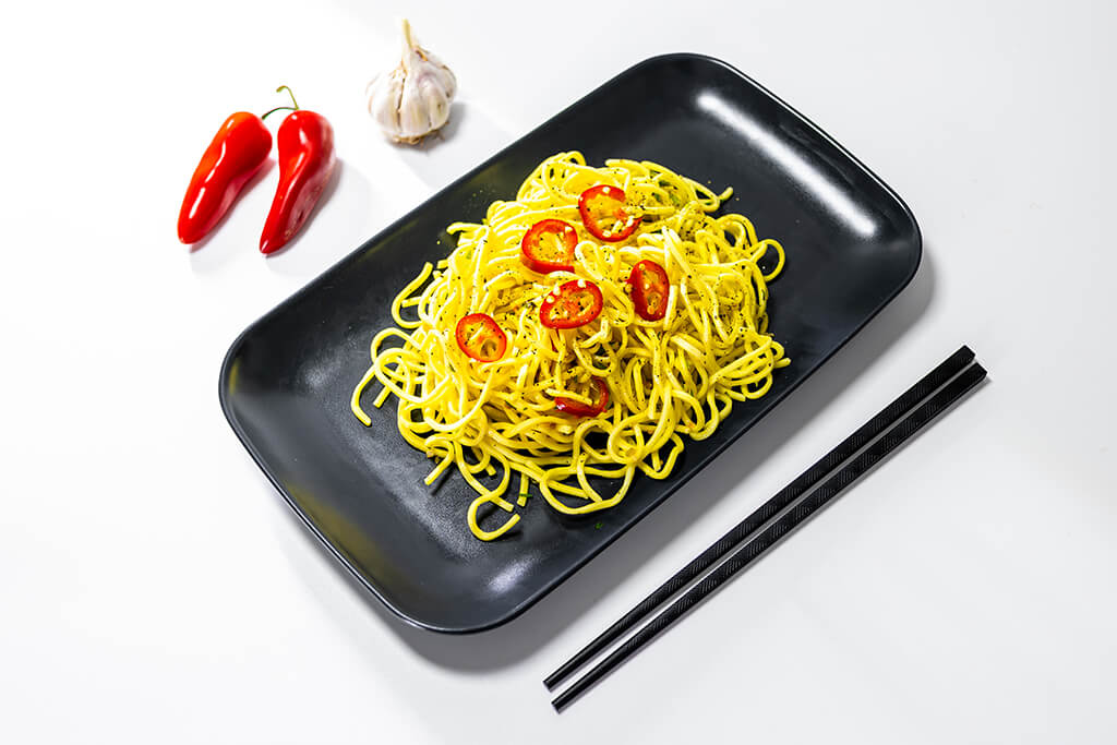 Chilli & Garlic Spaghetti with chop sticks and chilli/garlic decorations