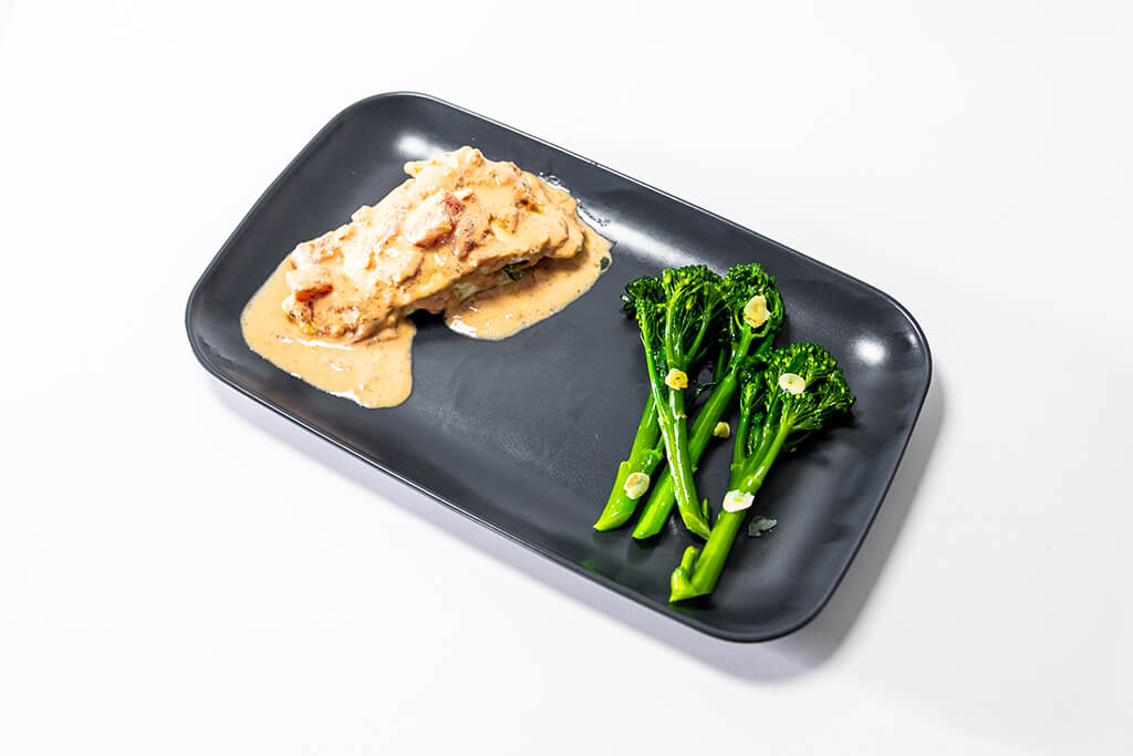 Bass with Creamy Tomato Sauce with a side of tender stem broccoli