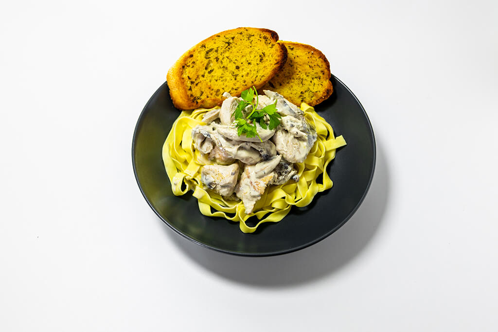 Creamy Chicken & Mushroom Tagliatelle with a garlic bread side
