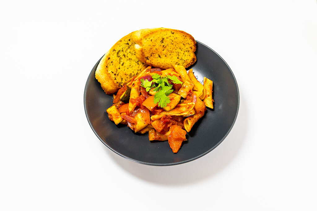 Veg Pasta Bake with a side of garlic bread