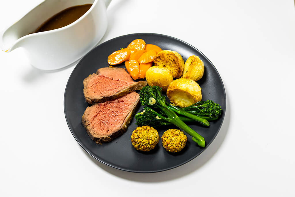 Beef Roast Dinner with a jug of gravy