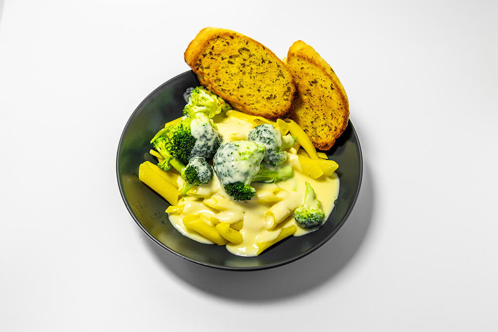 Cheesy Broccoli Pasta Bake with a side of garlic bread